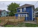 Home featuring a wood deck and balcony area at 24 N Randolph St, Indianapolis, IN 46201