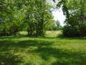 A well-maintained backyard with lush greenery and mature trees providing privacy and shade at 2625 S 200 E, Lebanon, IN 46052