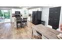 Modern kitchen with white cabinets, stainless steel appliances, and a black refrigerator at 2741 Fairlawn Dr, Columbus, IN 47203