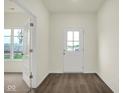 Bright entryway features attractive laminate flooring and a glass panel door at 2750 Glade Ave, Plainfield, IN 46168