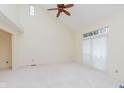 Spacious bedroom featuring a high ceiling, a ceiling fan, and a large window at 2916 Sunmeadow Way, Indianapolis, IN 46228