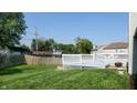 Expansive backyard featuring a lush lawn and a spacious white deck, perfect for outdoor entertaining and relaxation at 3959 Towhees Dr, Indianapolis, IN 46237