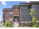 Townhouse featuring manicured landscaping, steps and modern curb appeal at 420 Monon Wy Dr, Carmel, IN 46032