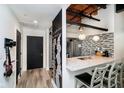 Charming kitchen with chalkboard wall, granite counters, stainless appliances, and pendant lighting at 430 N Park Ave # 211, Indianapolis, IN 46202