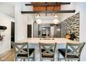 Well-equipped kitchen with breakfast bar, stainless appliances, and pendant lights at 430 N Park Ave # 211, Indianapolis, IN 46202