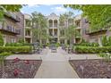 Beautifully landscaped courtyard with fountain, benches, and manicured greenery for relaxation at 450 E Ohio St # Apt 305, Indianapolis, IN 46204