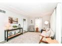 Inviting living room with plush carpet, stylish furniture, and elegant decor at 4751 Payton Ave, Lawrence, IN 46226