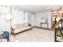 Bright and airy living room with a comfortable sofa and decorative accents at 4751 Payton Ave, Lawrence, IN 46226