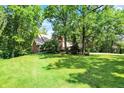 Beautiful home with a large, well-manicured lawn and mature trees, offering privacy and a serene setting at 5953 Deer Hollow Ct, Pittsboro, IN 46167