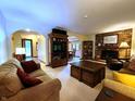 Open-concept living room with brick fireplace and views to dining and entryway at 6190 Red Day Rd, Martinsville, IN 46151