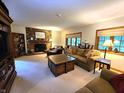 Spacious living room with fireplace, built-in bookshelves, and plush seating at 6190 Red Day Rd, Martinsville, IN 46151