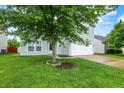 Charming two-story home with well-maintained lawn and a two car garage at 630 Harmony Way, Greenwood, IN 46143