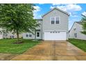 Charming two-story home with well-maintained lawn and a two car garage at 630 Harmony Way, Greenwood, IN 46143