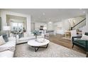 Open-concept living space combining living, dining, and kitchen areas with modern finishes at 6857 Jacone Dr, Brownsburg, IN 46112