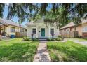 Inviting home with landscaped front yard, walkway, and cozy front porch at 923 42Nd St, Indianapolis, IN 46205