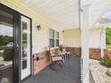 Inviting porch with seating and a view, creating a relaxing outdoor space at 1108 Northfield Ln, Anderson, IN 46011