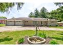 Charming one-story home with stone facade, two-car garage, and well-maintained front yard at 132 S First St, Jamestown, IN 46147