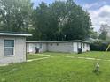 Exterior shot of a multi unit building featuring small lawn and neutral siding at 1642 W 6Th St, Anderson, IN 46016