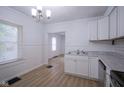 Well-lit kitchen boasts stainless appliances, white cabinets, and an open layout at 2012 George St, Anderson, IN 46016