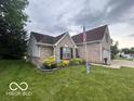 Beautiful home with brick and vinyl siding, and a well manicured yard and landscaping at 2018 Alysheba Dr, Indianapolis, IN 46234