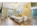 Spacious living room with a large sectional sofa and views into the adjacent kitchen area at 2114 Turning Leaf Dr, Franklin, IN 46131
