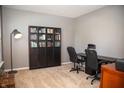 Cozy office space with neutral carpet, a dark desk, a bookcase, and a comfortable workspace at 2233 Burgundy Way, Plainfield, IN 46168