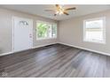 Bright living room with large windows and neutral wall paint at 3614 N Whittier Pl, Indianapolis, IN 46218