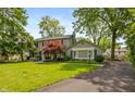 Attractive home showcasing a well-manicured lawn and a driveway leading to the side, offering ample parking at 3713 Coventry Way, Carmel, IN 46033