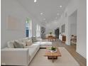 Spacious living room with modern finishes featuring recessed lighting and hardwood flooring at 4234 Kingsley Dr, Indianapolis, IN 46205