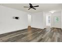 Bright living room features hardwood floors, a ceiling fan, and neutral paint at 5125 Lilium Dr, Plainfield, IN 46168