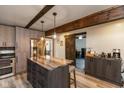 Stylish kitchen with an island, stainless steel appliances, and a warm, inviting ambiance at 615 E Stop 11 Rd, Indianapolis, IN 46227