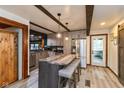 Modern kitchen featuring a large island with seating, stainless steel appliances, and unique beamed ceiling at 615 E Stop 11 Rd, Indianapolis, IN 46227