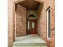 Welcoming entryway with a solid brick archway leading to the front door at 6307 Keeneland Ct, Indianapolis, IN 46278