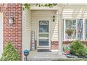 Inviting front entryway with decorative accents, a welcome sign, and a charming storm door at 671 Sonoma Ln, Greenfield, IN 46140
