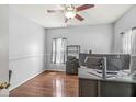 Home office with hardwood floors, neutral walls, and a ceiling fan at 671 Sonoma Ln, Greenfield, IN 46140