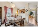Charming dining room with a round table, patterned chairs, and a view into the breakfast nook at 69 Stoneybrook Dr, Greenwood, IN 46142