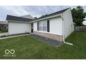 A charming home with a well-maintained lawn and simple, attractive landscaping at 7022 Cordova Dr, Indianapolis, IN 46221