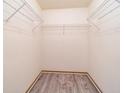 Empty closet features wire shelving for optimal storage solutions with neutral walls and modern vinyl flooring at 7545 Briarstone Dr, Indianapolis, IN 46227