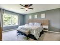 Comfortable main bedroom filled with natural light and carpet floors at 7942 Dillon Pl, Indianapolis, IN 46236