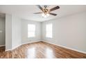 Bright, spacious bedroom with hardwood floors, ceiling fan and lots of natural light at 9220 Crossing Dr, Fishers, IN 46037