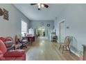 Spacious living room with hardwood floors, ceiling fan, and an open layout, needs TLC at 952 Lasalle St, Indianapolis, IN 46201