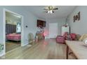 Bright living room showing hardwood floors, neutral walls and views into the adjacent bedroom at 952 Lasalle St, Indianapolis, IN 46201
