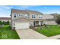 Attractive two-story home with a well-maintained lawn and driveway at 10515 Sugar Ridge Way, Indianapolis, IN 46239