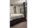 Relaxing main bedroom with four poster bed frame, calm decor, dresser, and soft carpet at 10835 Spirit Dr, Ingalls, IN 46048
