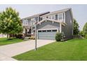 Two-story home with well-kept lawn, two car garage, and driveway basketball hoop at 10962 Stoneleigh Dr, Noblesville, IN 46060