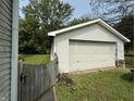 Detached one car garage with white siding, offering extra storage at 11026 N Kitchen Rd, Mooresville, IN 46158