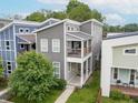 Stunning aerial view of a modern two-story home with a private balcony and well-maintained landscaping at 1209 Cottage Ave, Indianapolis, IN 46203