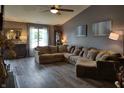 Spacious living room with vaulted ceilings, a large sectional sofa, and modern flooring at 2432 Bridlewood Dr, Franklin, IN 46131