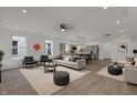 Spacious open-concept living room and kitchen features stylish furnishings and stainless steel appliances at 2903 Winthrop Ave, Indianapolis, IN 46205