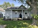 Back exterior view of home and covered back porch at 420 S Oak St, Fortville, IN 46040